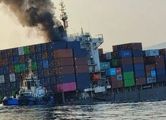 IRAN CLAIMS CONTAINERSHIP HIT MINE AND SANK IN STRAIT OF HORMUZ